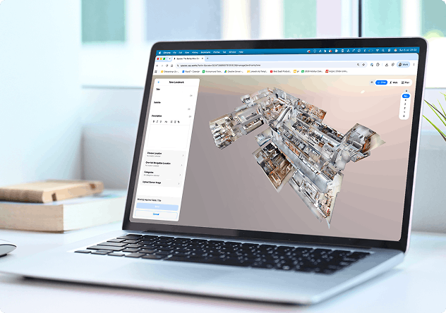 A 3D scan of a shopping centre open in the Spaces editor on a laptop